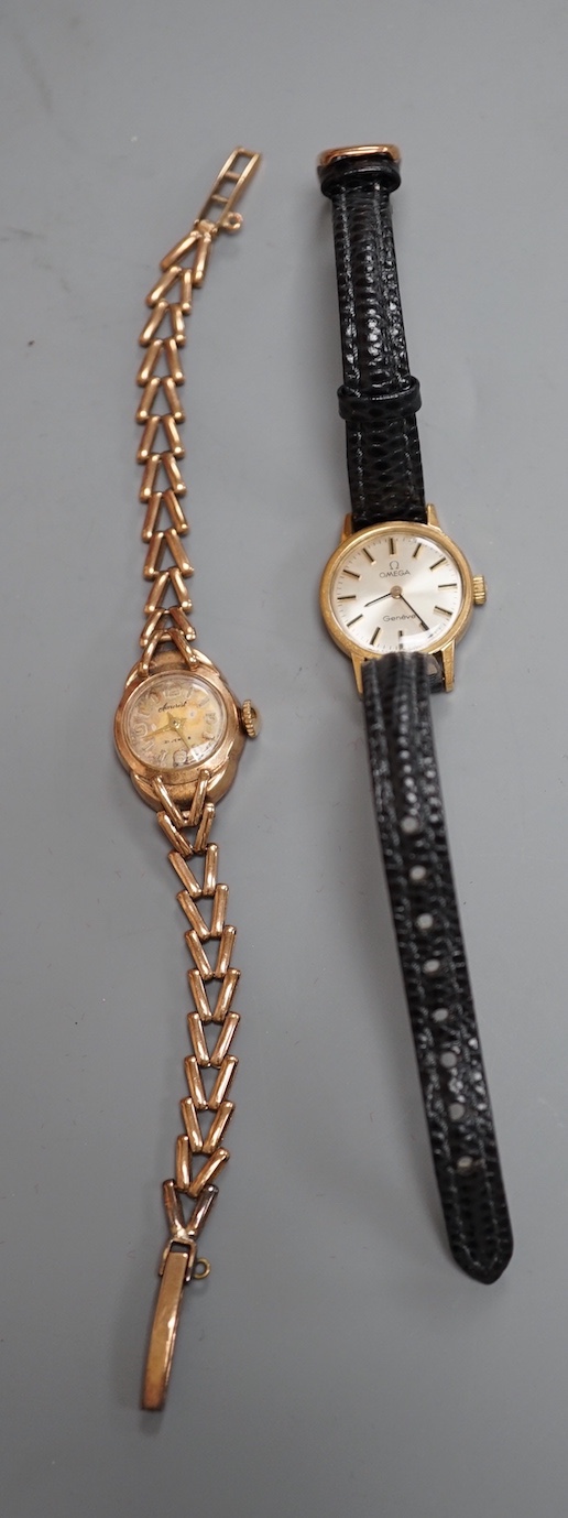 A lady's 9ct gold Accurist manual wind wrist watch, on a 9ct gold bracelet, gross weight 13 grams and a lady's steel and gold plated Omega manual wind wrist watch, on a leather strap.